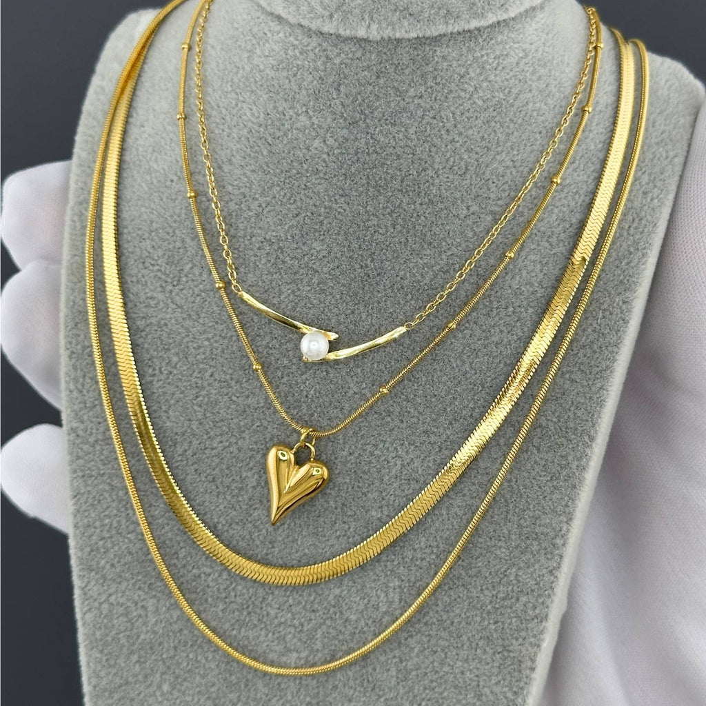 Layered Open heart pendant necklace in 18K gold-plated stainless steel with a minimalist romantic design.