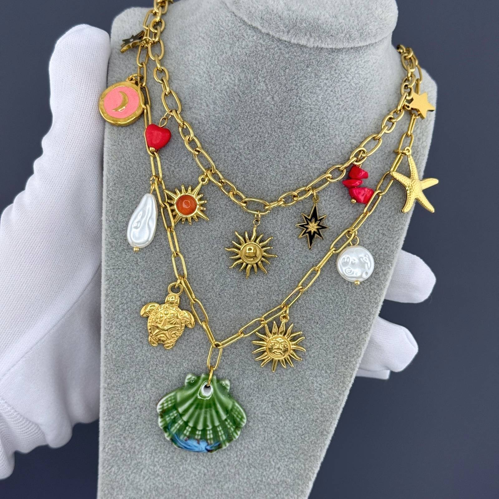 Layered Green seashell pendant necklace featuring pearl accents, starfish charm, and coastal-inspired details crafted from waterproof hypoallergenic stainless steel.
