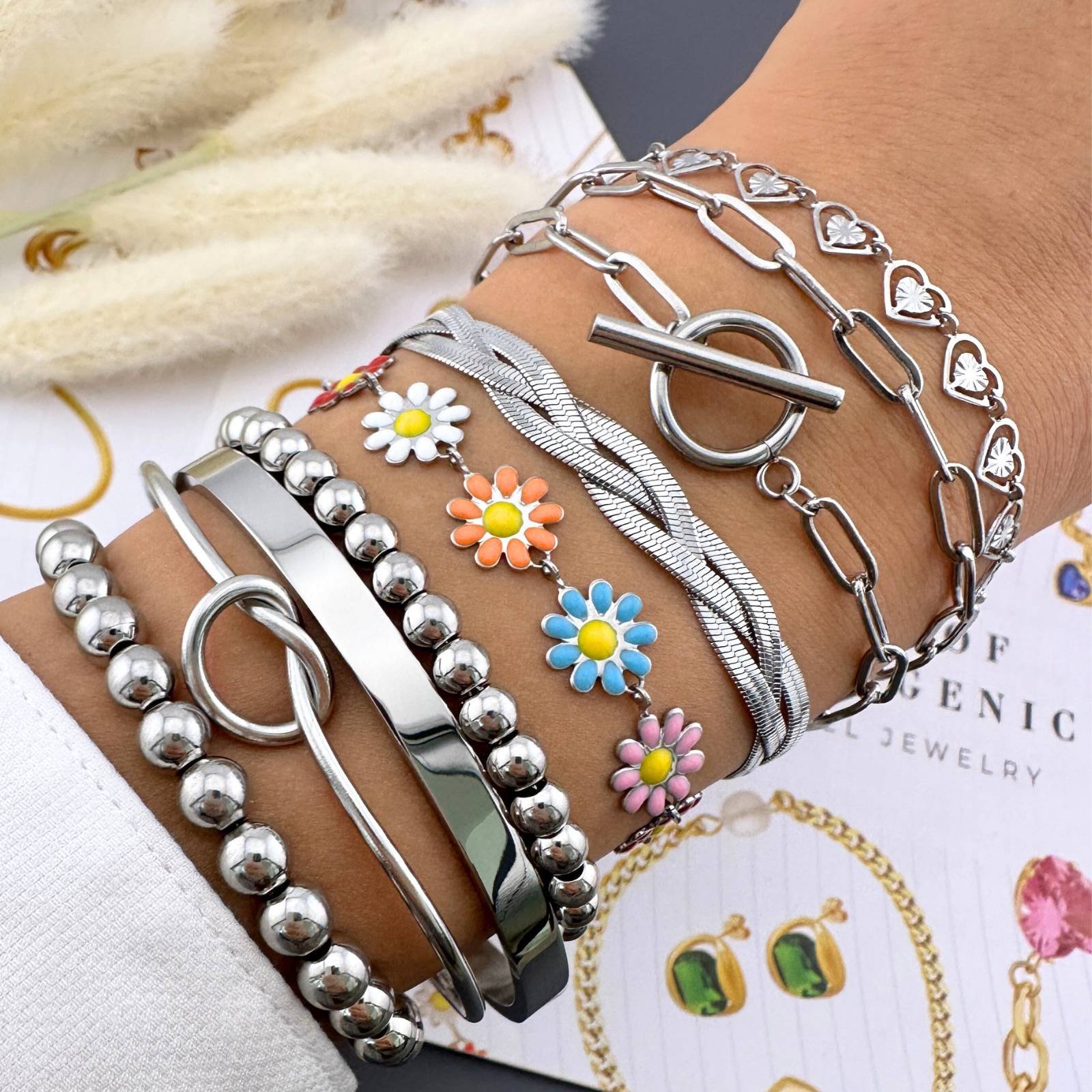 Layered Stainless steel bracelets including the featuring delicate open heart charms with an adjustable chain design.
