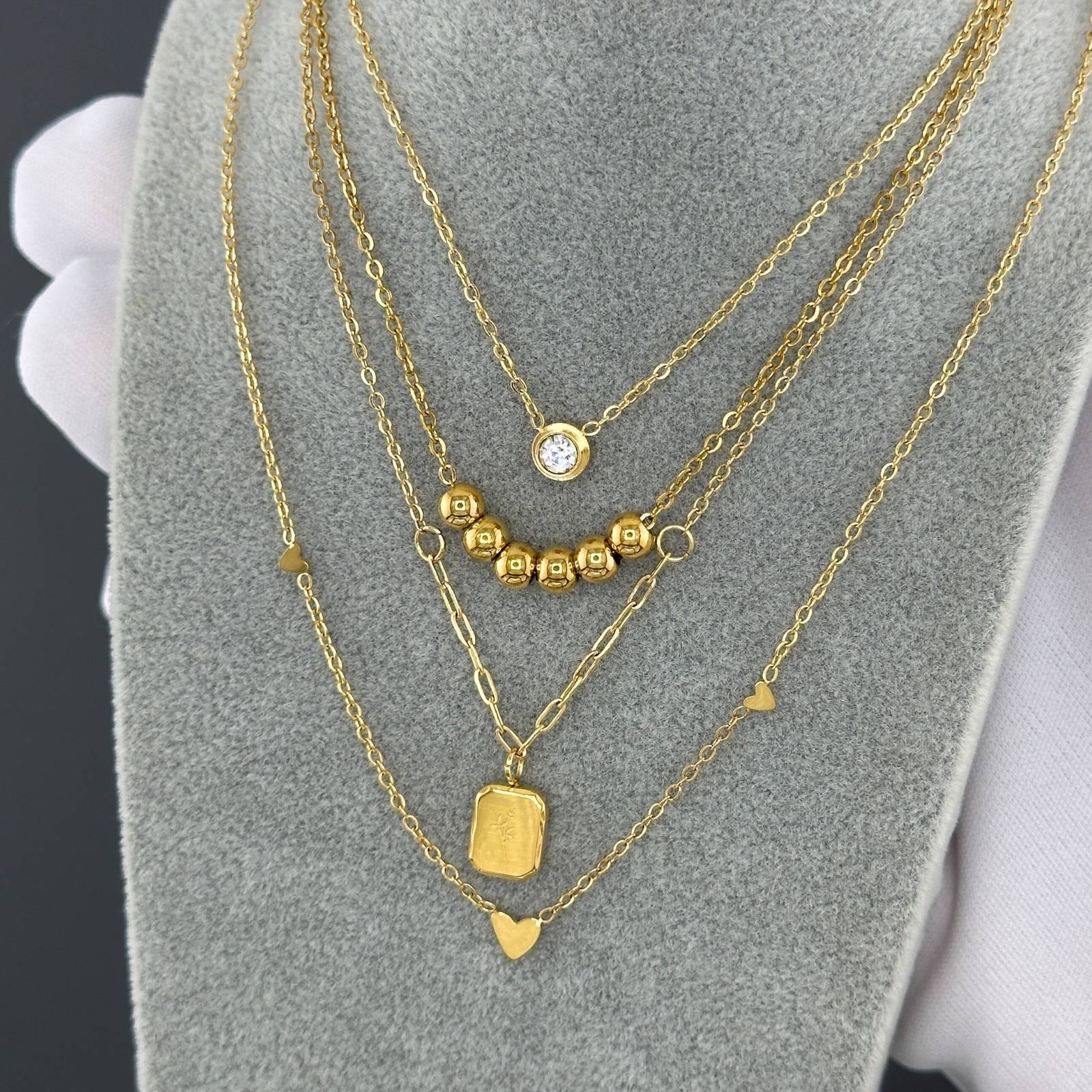 Layered Minimalist solitaire cubic zirconia necklace in 18K gold-plated stainless steel.