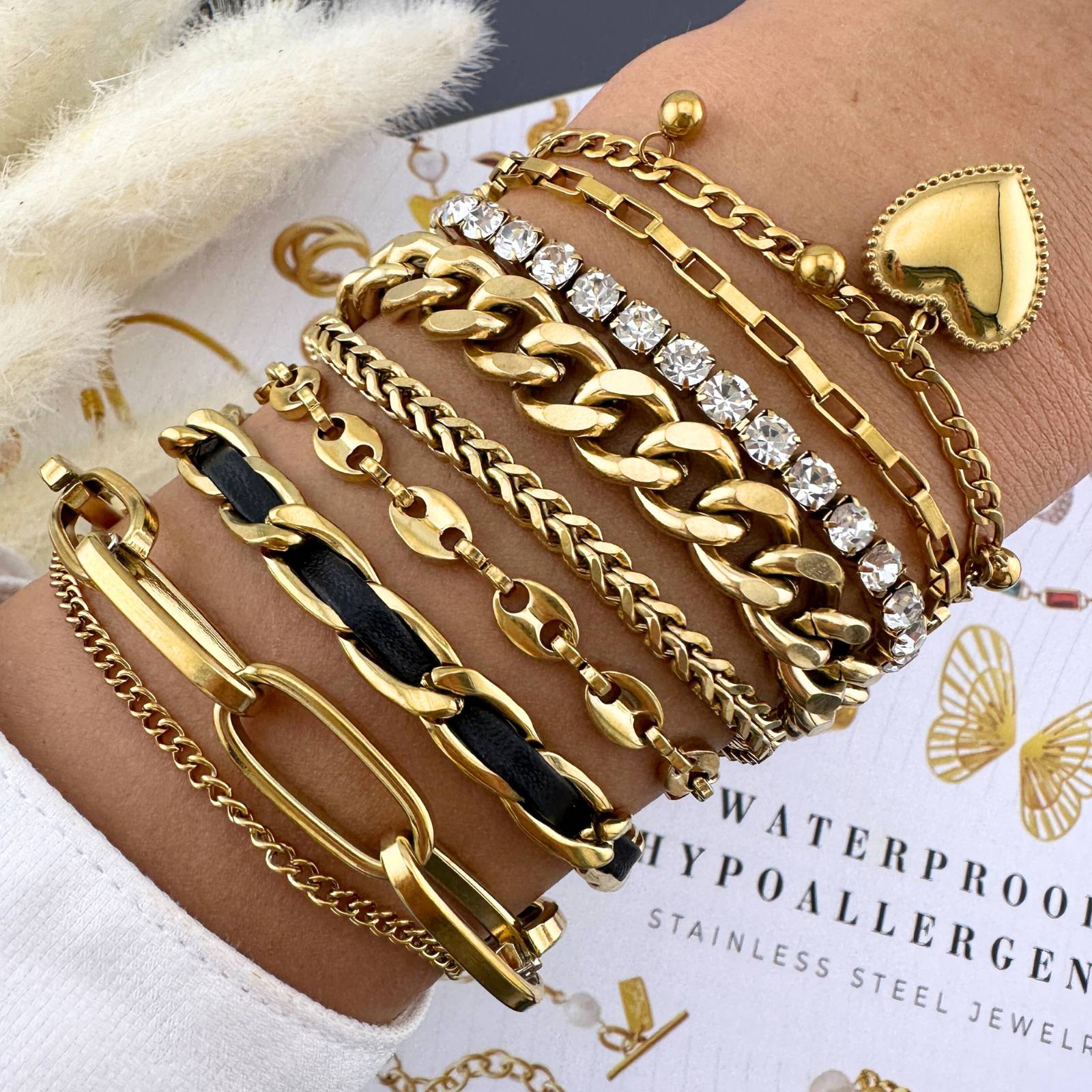 18K gold plated stainless steel bracelets  featuring the  layered chains and dangling heart charms.