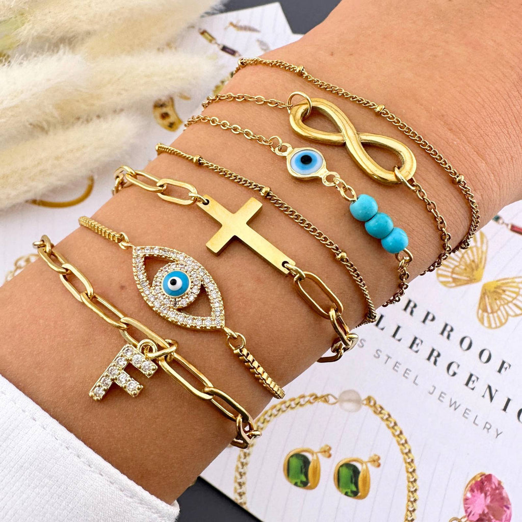 Layered 18K gold plated stainless steel infinity bracelet featuring a delicate double-chain design and adjustable fit.
