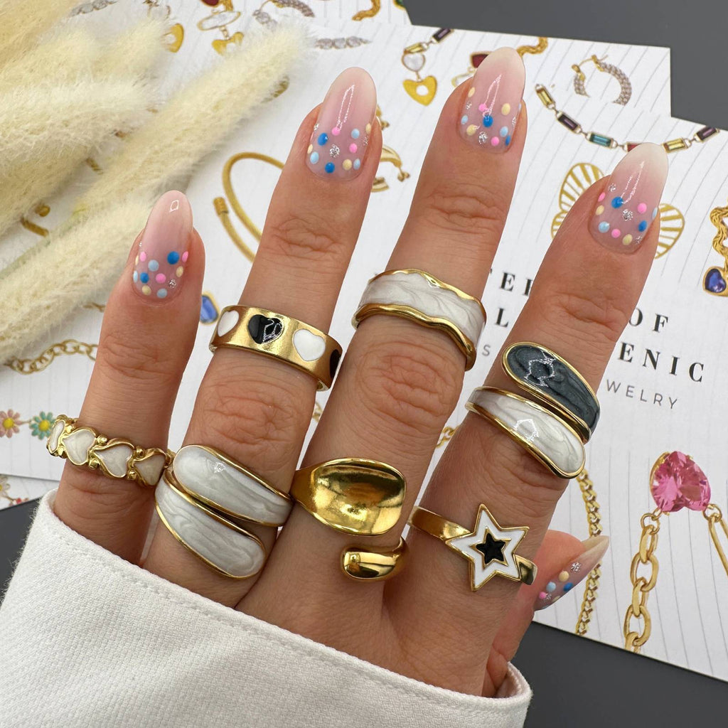 18K gold plated stainless steel adjustable rings featuring white and black enamel designs.