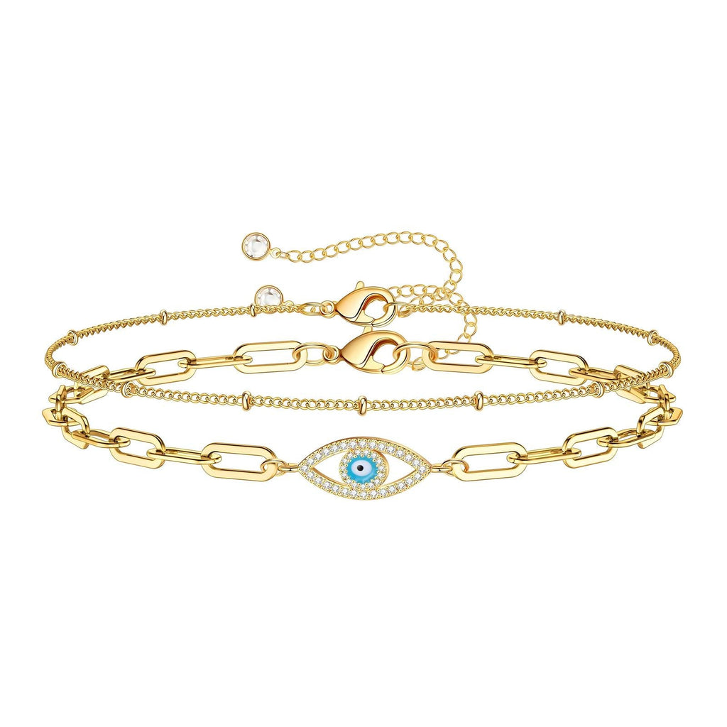 18K gold plated stainless steel layered bracelet featuring a cubic zirconia evil eye charm and adjustable chain design.