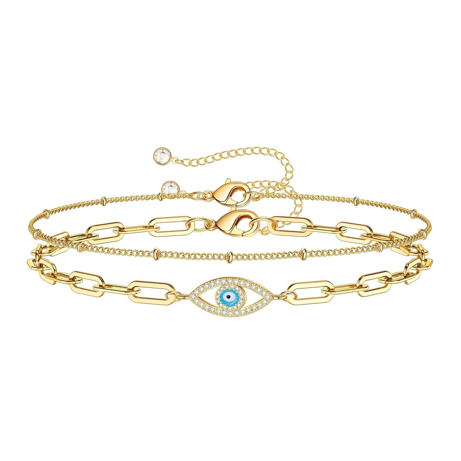 18K gold plated stainless steel layered bracelet featuring a cubic zirconia evil eye charm and adjustable chain design.