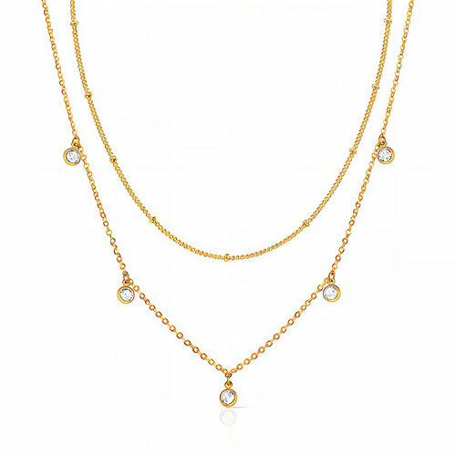 Layered gold necklace with delicate cubic zirconia charms in 18K gold-plated stainless steel.