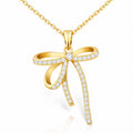 Crystal bow pendant necklace in 18K gold-plated stainless steel with sparkling cubic zirconia stones.