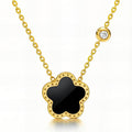 Black flower pendant necklace with cubic zirconia accent in 18K gold-plated stainless steel.