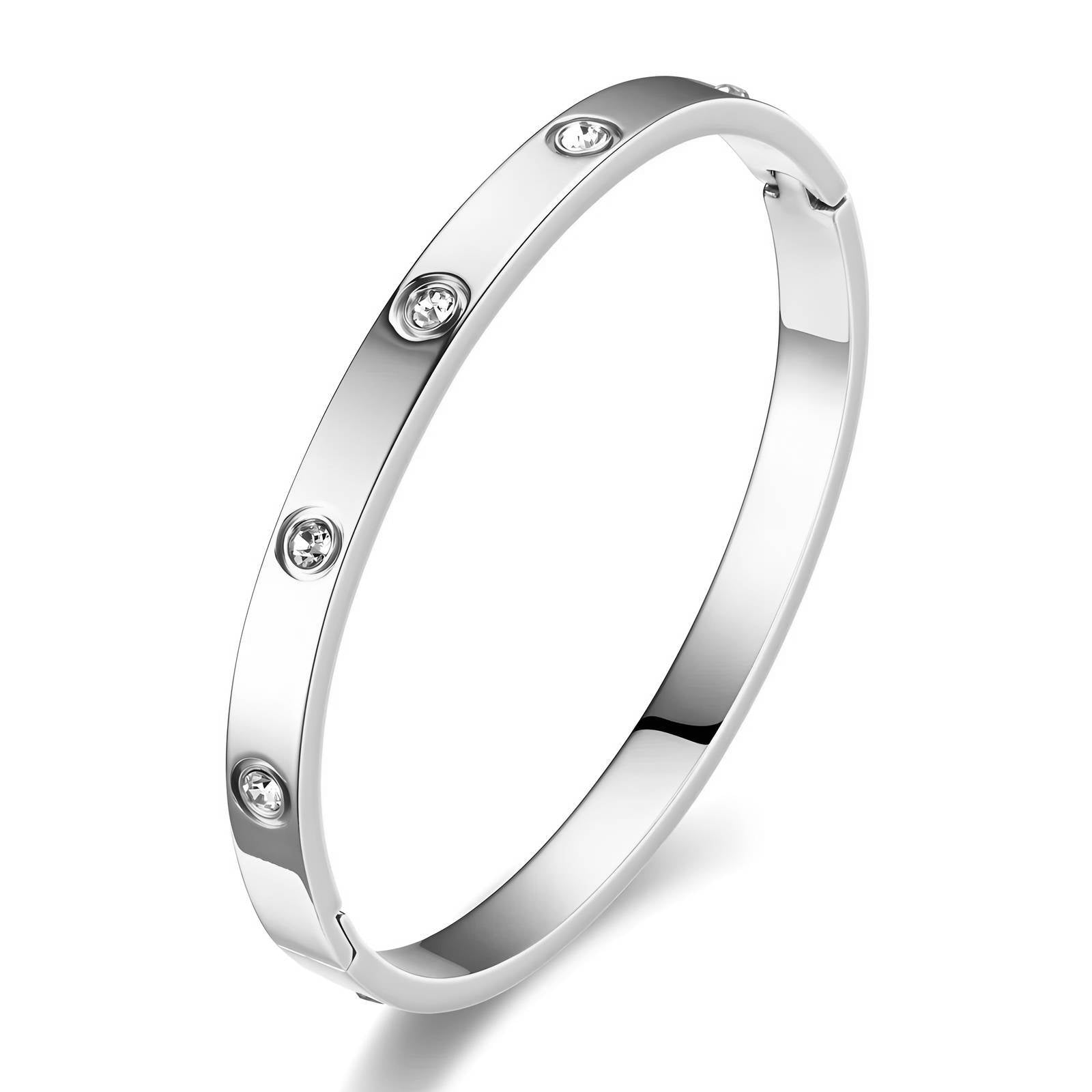 Stainless steel bangle bracelet featuring sparkling cubic zirconia stones and a sleek polished silver-tone finish.