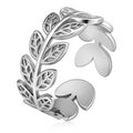 Stainless steel adjustable ring featuring an intricate botanical leaf design with detailed openwork accents.