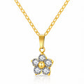 Daisy flower pendant necklace with sparkling cubic zirconia stones in 18K gold-plated stainless steel.