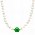 Pearl necklace with emerald green centerpiece crafted from 18K gold-plated stainless steel.