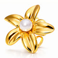 Gold flower ring with a pearl-inspired center in 18K gold-plated stainless steel.