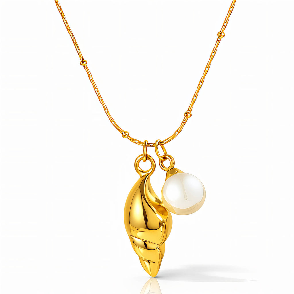 Gold seashell necklace with pearl accent crafted from waterproof hypoallergenic 18K gold-plated stainless steel.
