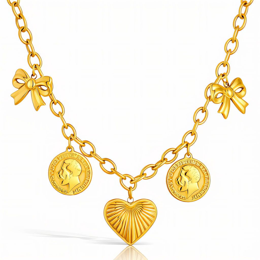 Gold charm necklace featuring a heart pendant, bow accents, and vintage coin charms crafted from waterproof hypoallergenic stainless steel.