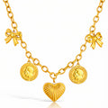 Gold charm necklace featuring a heart pendant, bow accents, and vintage coin charms crafted from waterproof hypoallergenic stainless steel.