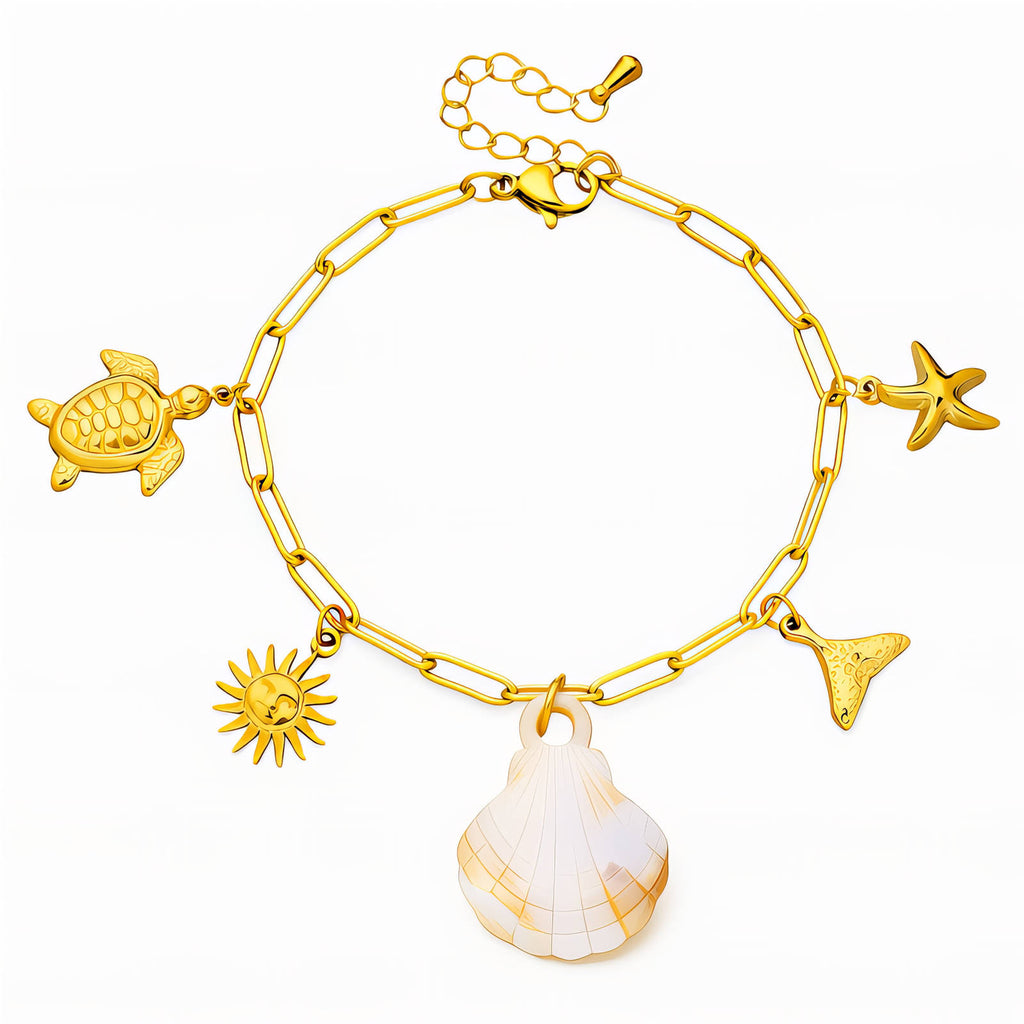 18K gold plated stainless steel ocean charm bracelet featuring seashell, starfish, sea turtle, sunburst, and whale tail charms with adjustable chain.